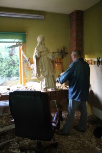 Artist working on statue